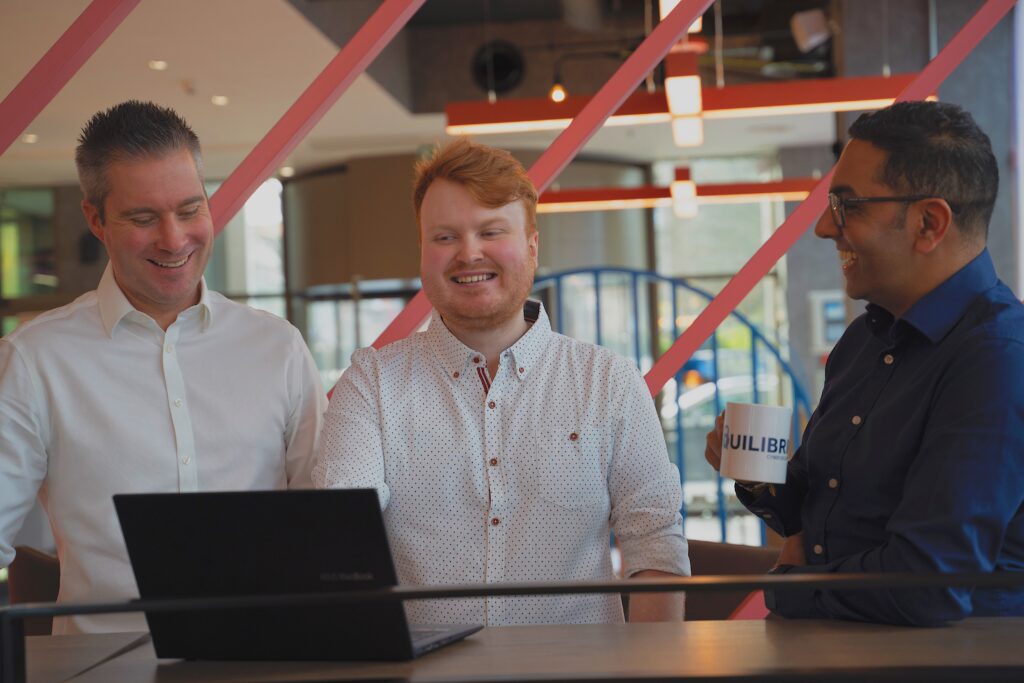 Equilibrium Security team laughing during work discussion